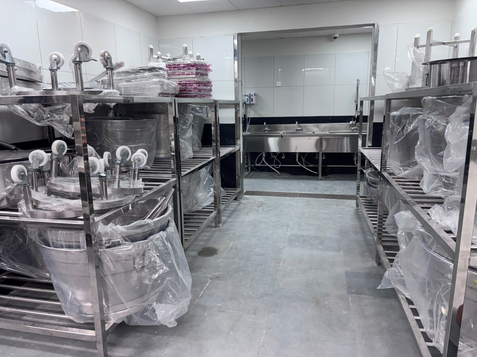 Commercial kitchen installation - storage racks and wash sinks